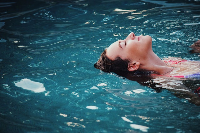woman relaxing swim spa